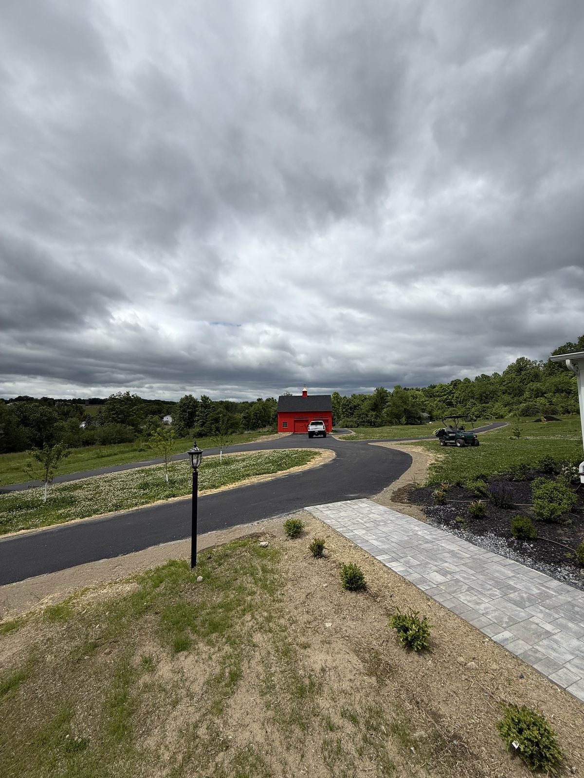 New paved access road with curbing and plantings on a commercial site, Dutchess County NY