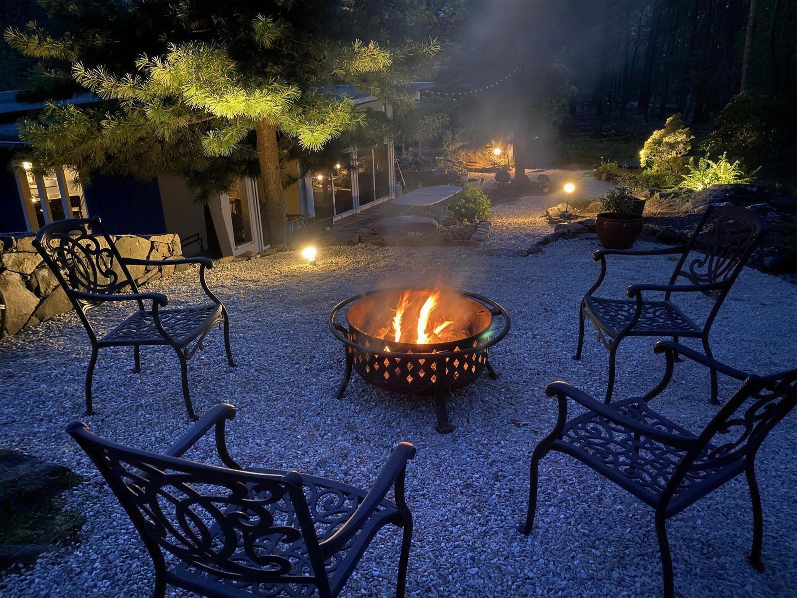 Fire pit burning at night on a White Oak paver patio in Dutchess County, NY